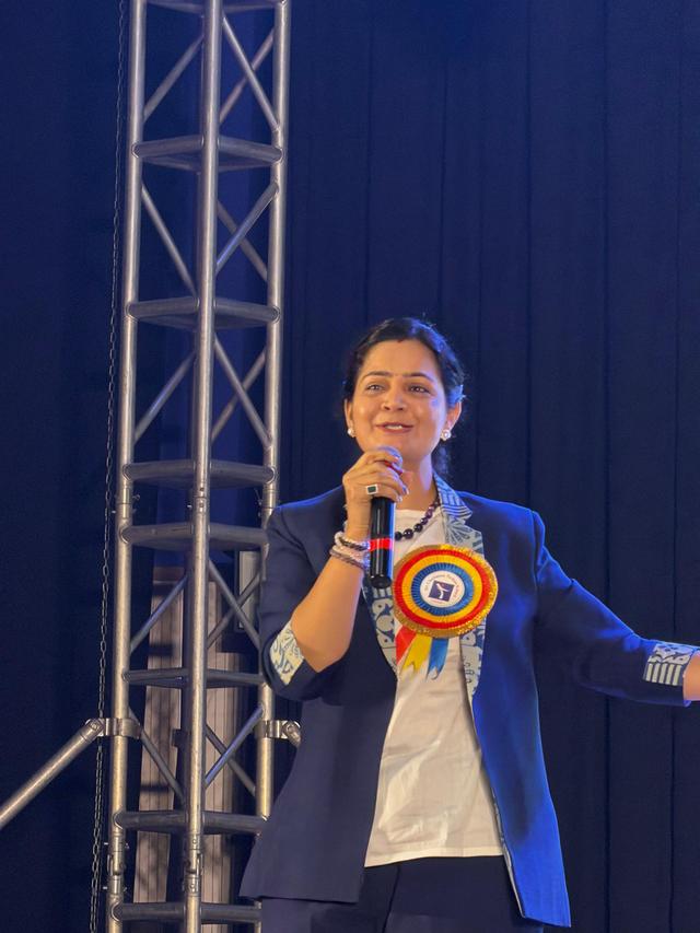 Dr. Preeti speaking at an event