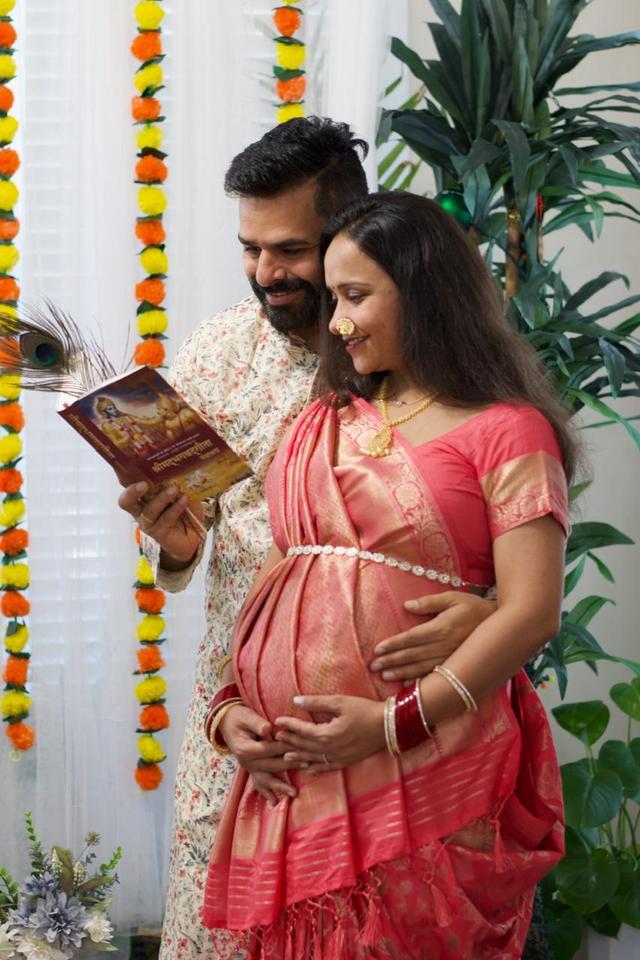 Expecting couple reading together